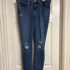 Women's Mid-Blue Ripped Skinny Jeans with Stretch